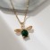 Piece "Beetle" green insert, green color in gold, 45 cm