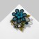 Brooch "Flower" with curls, sea color in ferrous metal