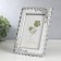 Photo frame 13x18 cm "roses with ribbons" with white 22.5x17.5 cm