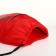 A bag for shoes on a lace, “ZFTS”, an outer pocket, a reflective strip, red color red