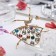 Brooch "Ballerina" in a dress, colored in gold