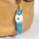 Fluffing on a pendant with colored bells mix