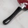The “Expert” pan, D = 24 cm, glass cover, plastic handle, anti -stick coating, burgundy color