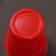 A glass of plastic disposable “torch Extra”, 500 ml, red-white color