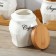 A set of ceramic cans for bulk products on an esthete wooden stand, 3 items: 650 ml, white color