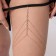 Erotic accessory on the thigh with rhinestones, golden