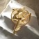 Brooch "Virgin" with a ball, white color in matte gold