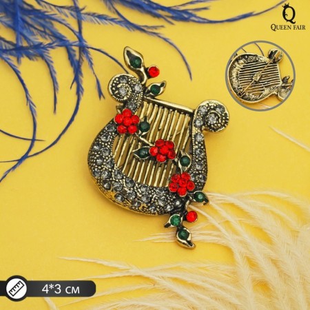 Brooch "Lira flowering", colored in black gold