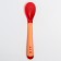 A spoon for feeding, thermal sensitive, red-beige color