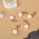 Sharmik "Flower" rose, white-pink color in gold