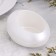 Summary "drop" from gypsum, 14.5x10x6.5cm, white mother of pearl