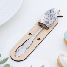 A teaspoon spoon with an engraving 