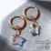 Earrings with the removable element "Transformer" Krystallik Asterisk, Rainbow color in gold