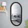 Capsula mirror, 80 x 45 cm, in a black frame