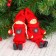 Toy - suspension "Doll in a suit", red color, mix