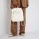 Women's backpack made of artificial leather with lightning, 3 pockets, milk color