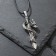 Unisex “Dragon” pendant with a sword, color black silver on a black lace, 44 cm