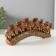 Souvenir Polystone "Seven African elephants in the gold, openwork blanket" 10.7x29x4 cm