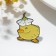 Icon "duckling" with a flower, colored in ferrous metal