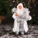 Santa Claus "in a high cap, in a strap and with a bag" 30 cm, silver-white