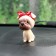 Dog on a car panel shocking his head, pug