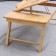 A trailer for a laptop with folding legs, 55.5 × 32.5 × 22 cm, bamboo