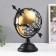 Souvenir Metal "Globe with an arrow" Black 27x17x30 cm