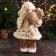 Santa Claus "in a fluffy fur coat, cap, with a gift" 47 cm, white-golden