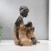 Souvenir Polystone "African with a child" under a tree 18.5x17.5x10.5 cm