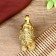 NECK Polystone "Elephant with coins" of bronze 8.5x8 cm