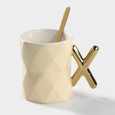 Ceramic mug with a spoon 