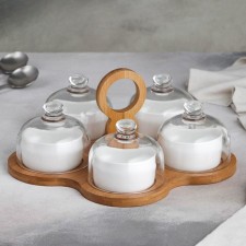 A set of ceramic saucers on a wooden stand 