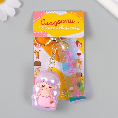 A keychain plastic, rubber with a carbine, a rosel strap of pink 3x3.5x5 cm