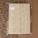Knitted lace, 25 mm × 10 ± 1 m, beige color