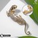 Brooch "Lizard" is narrow, white color in gold