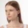 Earrings with pearls "Aurora" path on the ring, the color is white in gold