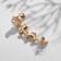 Earring "caffe" chamomile with rhinestones, white color in gold, l = 5 cm