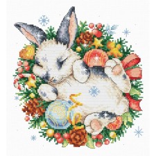 A set of embroidery with a cross on a canvas with a drawing 