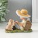 Souvenir Polystone "A boy in a clearing reads a book with a dog" 11x5.5x8.5 cm
