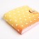 Wallet on the button, yellow/orange color
