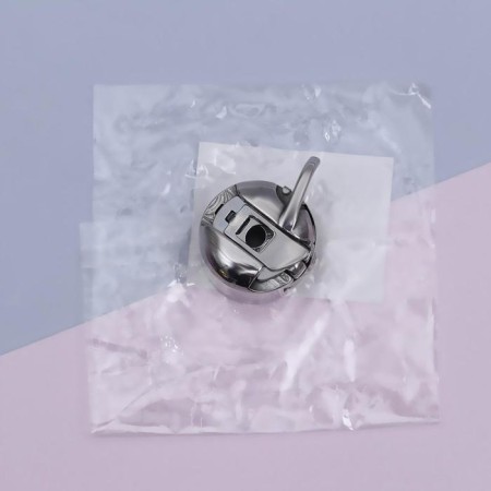 Bobbin cap to BSHM, left, 3 × 2.5 × 1.5 cm-3