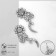 Earrings with rhinestones "flowers" bends, white color in silver