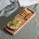 Defense board for feeding and serving with the ADELICA menage, 28 × 10 × 1.8 cm, birch