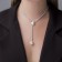 Pearls with pearls “chain” Olympia, two beads with a chain, white color in silver, 32 cm