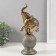 Souvenir Polystone "Elephant on a ball with patterns" of bronze with a patina 9.5x8x25.5 cm