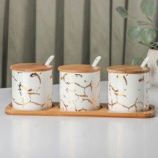 A set of ceramic cans with spoons on a wooden stand “Estet. Gold 