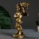 The candlestick "Angel" in the left hand, gold, 14x8x22 cm, for a candle d = 4 cm