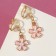 Clips children's “chosen” flower with pearls, white-peach color in gold