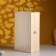 Gift box 34 × 21.5 × 10 cm is wooden, with a covering lid, with a handle