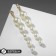 Earrings with pearls "grapes" bunch with a note, white color in gold